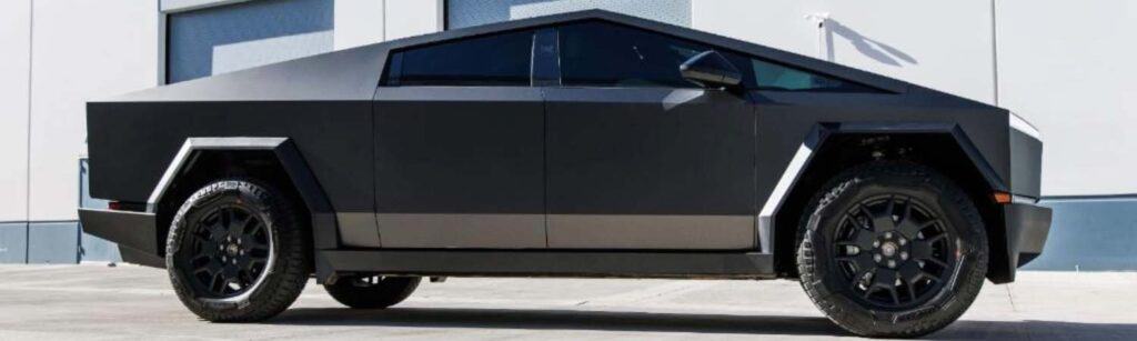 a Tesla cybertruck with mater wrap and window tint